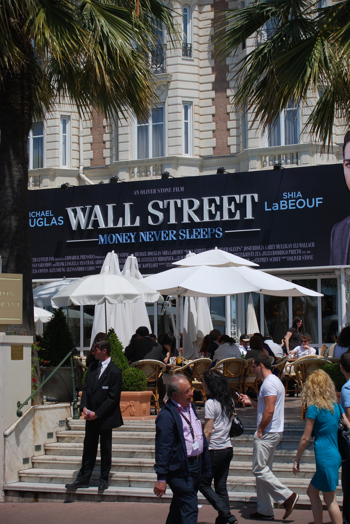 Photo on Wiki: https://commons.wikimedia.org/wiki/File:Wall_Street_2_Cannes_ad.jpg