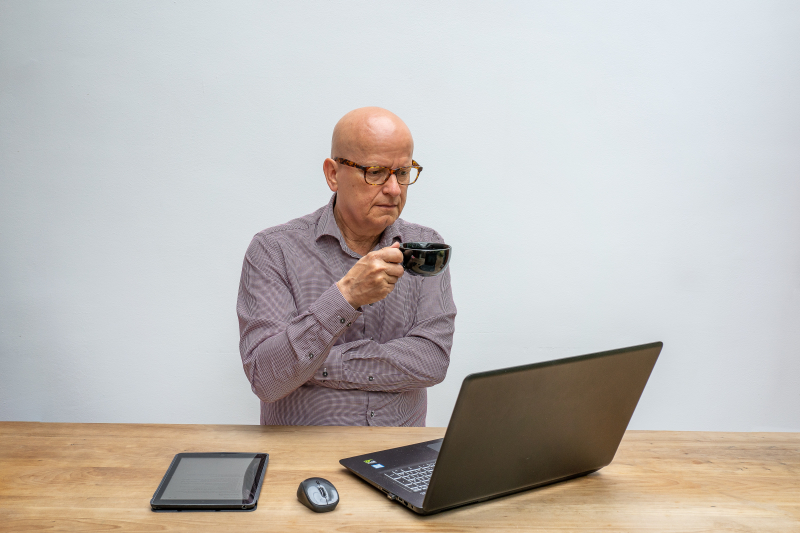 Photo by Mike van Schoonderwalt: https://www.pexels.com/photo/a-man-having-coffee-while-looking-at-a-laptop-5511628/