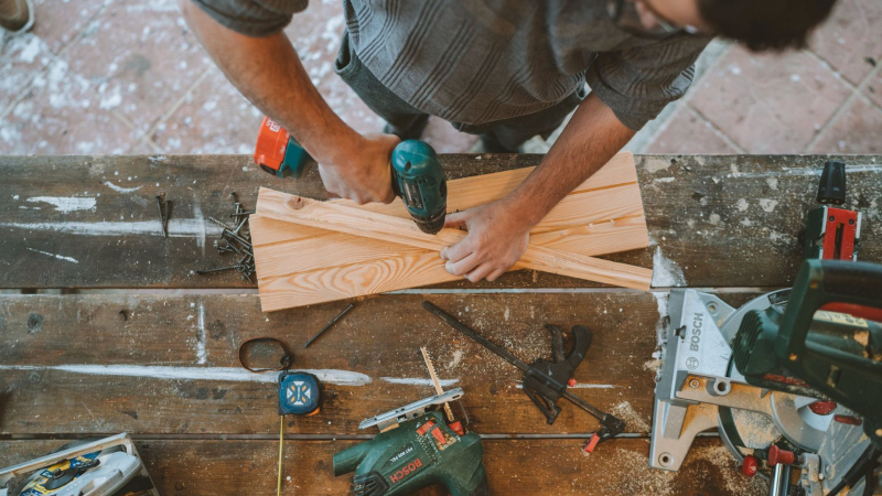 Photo by Anastasia Shuraeva on Pexels https://www.pexels.com/photo/a-man-drilling-hole-on-a-wood-6232443/